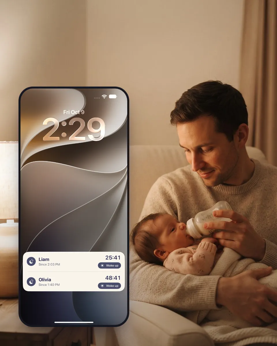 A father gives a bottle at night, next to the Lock Screen with sleep in progress.
